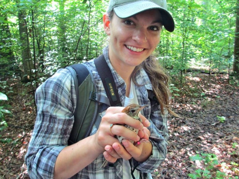 christa holding wood thrush in hand